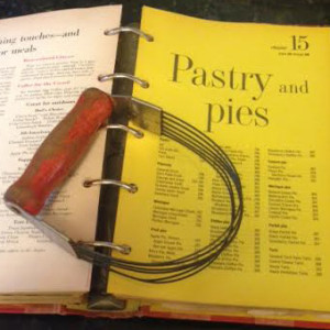 My vintage pie cutter is probably older than the 1965 cookbook beneath it.