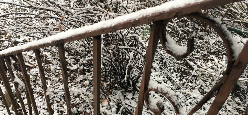 Snow on a metal railing